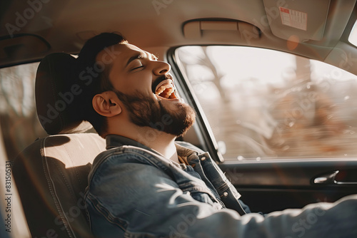 A man singing in a car photo