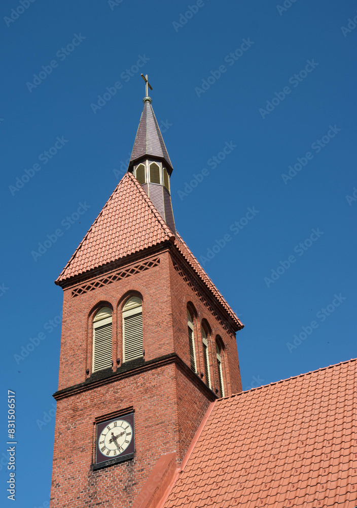 The clock tower and the tiled roof of the Lutheran church