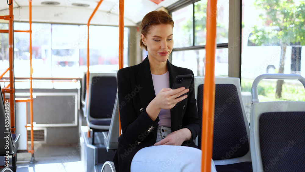 Beautiful woman using smartphone in the bus Beautiful woman using smartphone in the bus