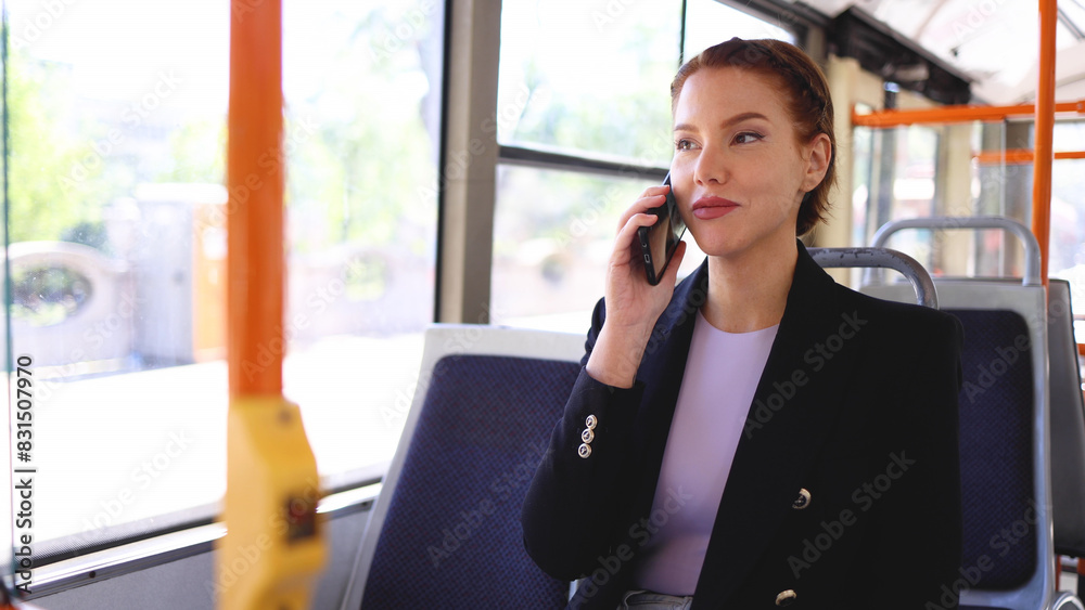 Young businesswoman telephoning in a city bus Young businesswoman telephoning in a city bus
