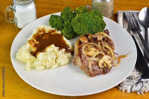 steak top with onions and mushrooms  with mash potatoes
