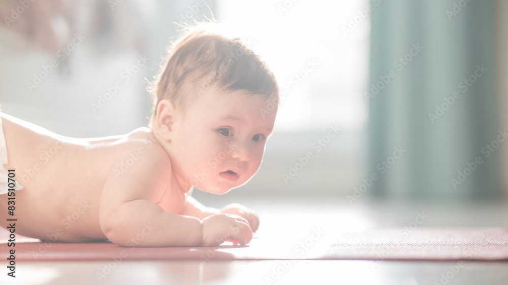Cute little boy lying on his forearms on the floor. Cute little boy lying on his forearms on the floor.