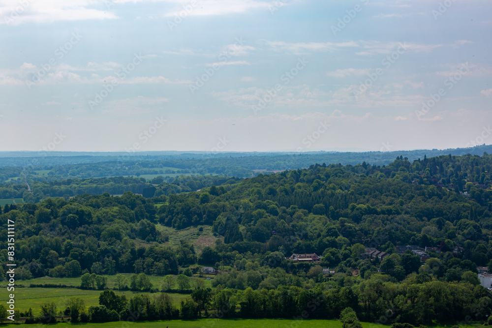 Landscape view of the English countryside on a warm spring day, Image shows a beautiful countryside view from the top of Box hill on the outskirts of London