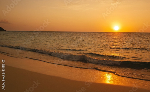Breathtaking Beach Sunset with Golden Sky, Turquoise Waters, and Serene Shoreline