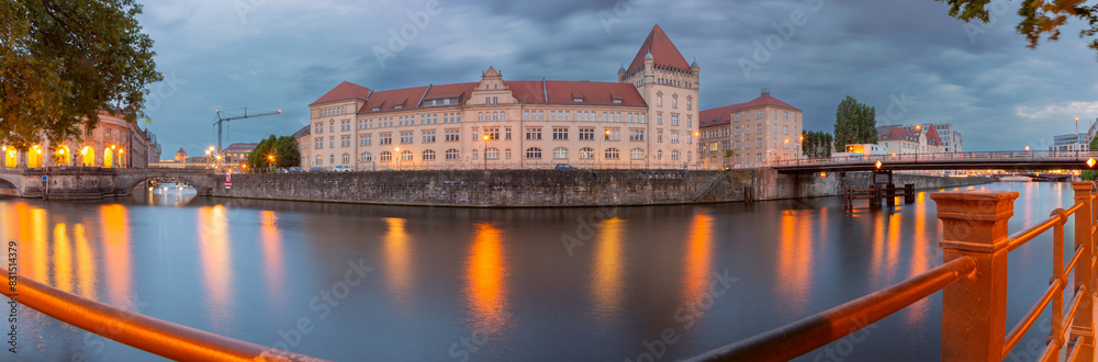 Embankment along the Spree river in the historical part of Berlin at sunset. Germany.
