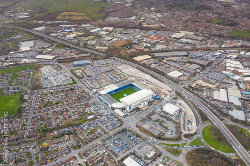 Aerial photo of the famous Elland Road football stadium in Leeds, West Yorkshire, England, which is home of Leeds United Football Club, showing fans attending a soccer match