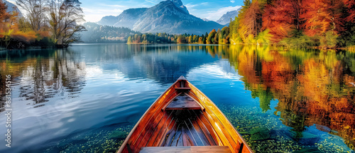 wooden boat on a large lake with trees and a beautiful view of the mountains - summer vacation concept - copy space