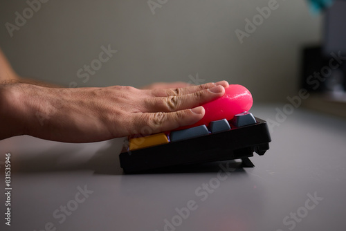 Clean your keyboard easily with a gel cleaner, an efficient solution for a dustfree workspace photo