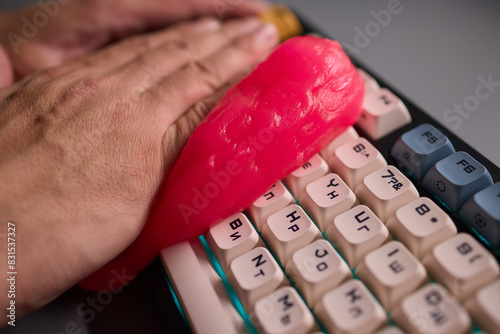 Clean your keyboard easily with a gel cleaner, an efficient solution for a dustfree workspace photo