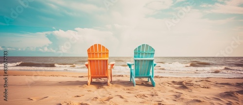 Two chairs on the beach. Va...