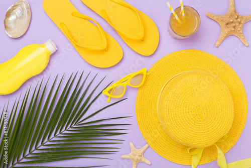 Flat lay with yellow summer outfit on color background. Vacation concept