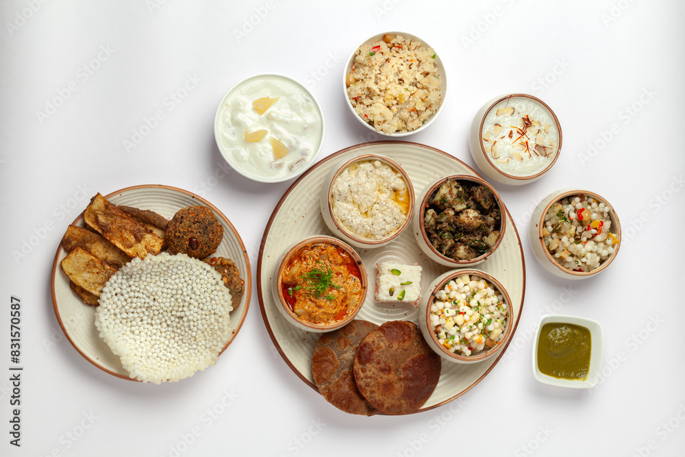 Top-view of Veg Indian food thali. Isolated on a white background. Top-view of Veg Indian food thali. Isolated on a white background.