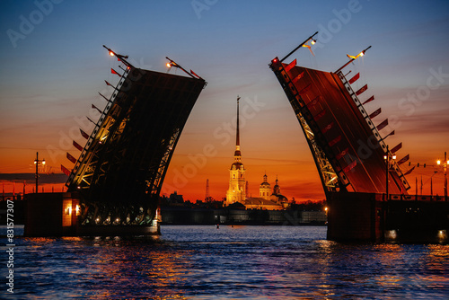 Lifting of Palace bridge in Saint Petersburg, view to Peter and Paul Cathedral photo