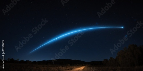 luminous glowing blue trail of shooting star on a dark night sky