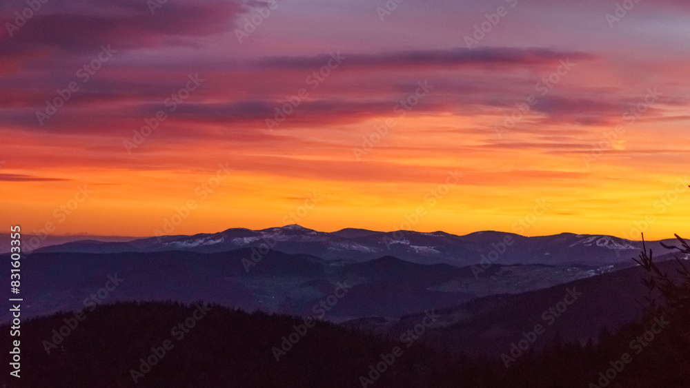 Sunset view with red colored sky at the Grand Brezouard at mountain landscape of Vosges in winter, Sainte-Marie-aux-Mines, Alsace, France