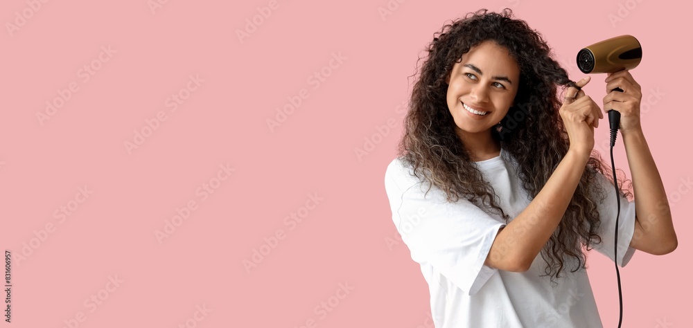 Happy African-American woman with hair dryer on pink background with space for text Happy African-American woman with hair dryer on pink background with space for text