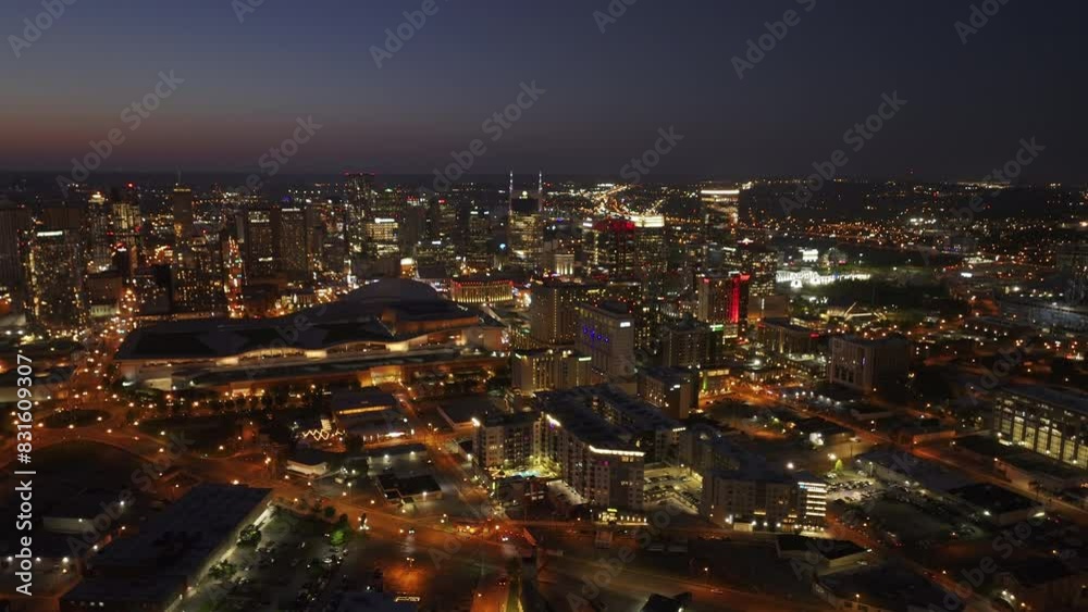 Aerial view of Nashville's vibrant downtown at night, capturing the city's lit skyline and lively streets. Urban concept of an American major city Aerial view of Nashville's vibrant downtown at night, capturing the city's lit skyline and lively streets. Urban concept of an American major city