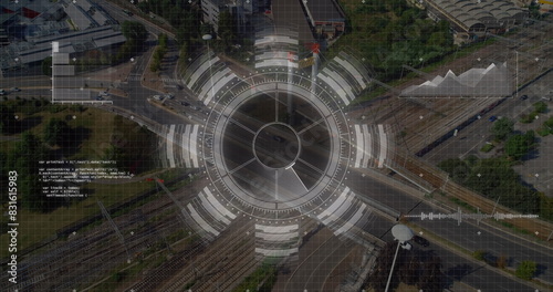 Image of round scanner and data processing against aerial view of city traffic