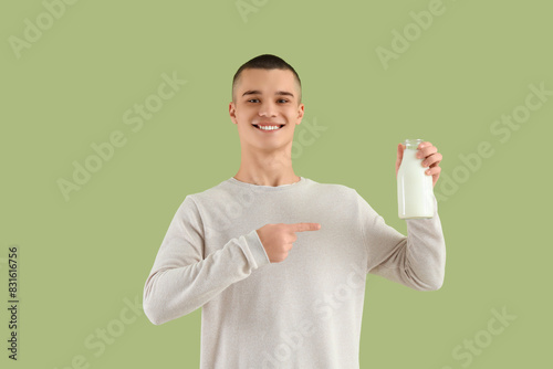 Teenage boy pointing at bot...