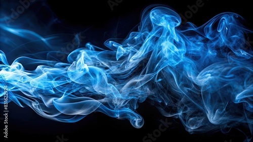 Abstract blue smoke swirling on a black background photo