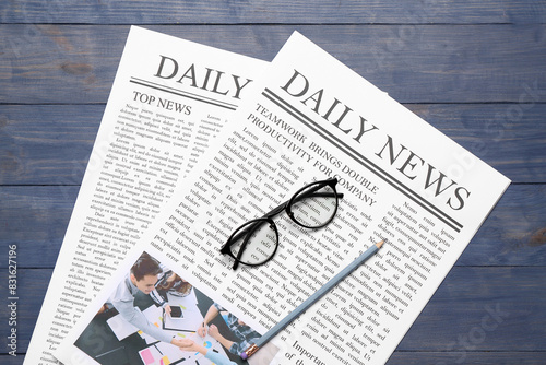 Newspapers with glasses and...