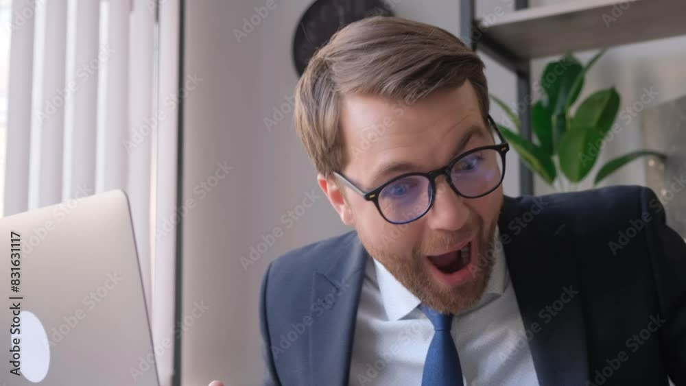 Man in a suit multitasks with laptop and phone, busy lifestyle Man in a suit multitasks with laptop and phone, busy lifestyle