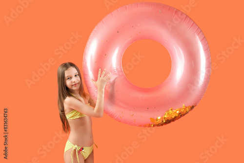 Cute little girl in swimsui...
