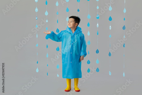 Cute little Asian boy in ra...