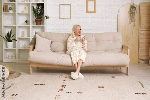 Mature woman in pajamas wit...