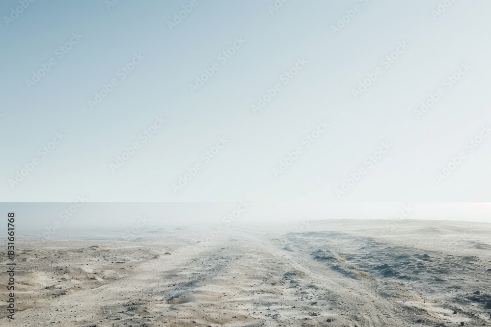 A desolate, barren landscape with a foggy sky. The sky is mostly clear, but there is a foggy haze that hangs over the land. The emptiness of the scene gives off a sense of loneliness and isolation