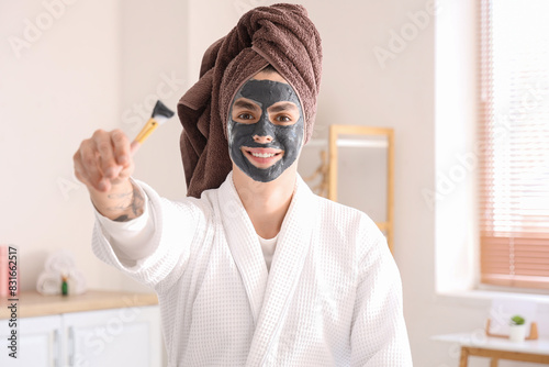 Young man with applied clay...