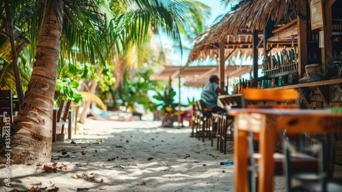 Tropical beach bar with sandy paths and palm trees
