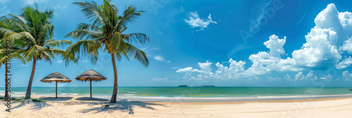 panoramic view of a tropical beach with palm trees and thatched umbrellas