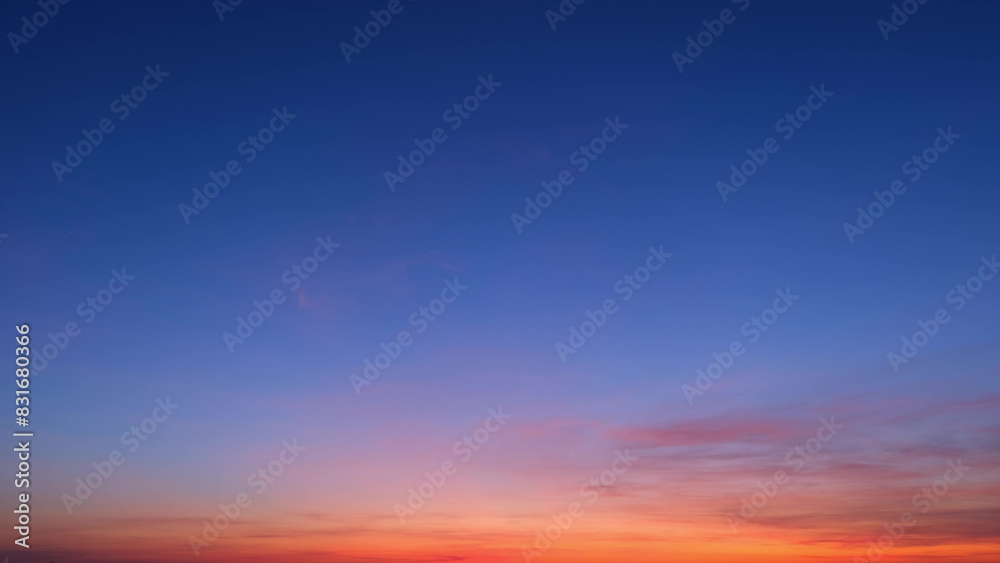 A beautiful gradient sky transitioning from deep blue at the top to vibrant orange and pink hues near the horizon. This serene sunrise showcases a peaceful dawn. Sunrise sky background.
A beautiful gradient sky transitioning from deep blue at the top to vibrant orange and pink hues near the horizon. This serene sunrise showcases a peaceful dawn. Sunrise sky background.