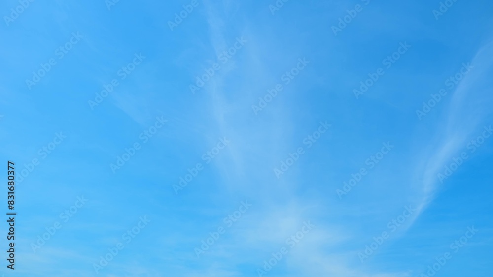 A bright blue sky with delicate, wispy clouds stretching across the frame. The soft, ethereal clouds create a serene and tranquil atmosphere, enhancing the beauty of the clear day. Cloud background.
A bright blue sky with delicate, wispy clouds stretching across the frame. The soft, ethereal clouds create a serene and tranquil atmosphere, enhancing the beauty of the clear day. Cloud background.