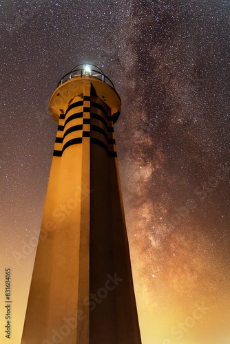 Karaburun Sarpincik lighthouse at night with stars and milky way photo