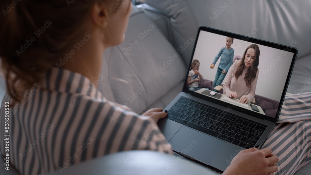 Home girl talking online using laptop closeup. Happy two sisters videocalling Home girl talking online using laptop closeup. Happy two sisters videocalling