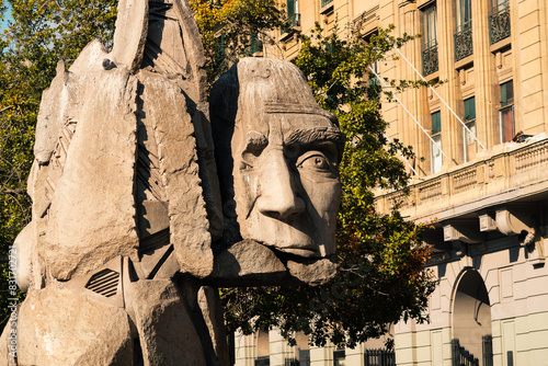 Memorial of native people of Chile, sculpture of the face of native Chilean people in the Plaza de Armas in Santiago de Chile, on a sunny day photo