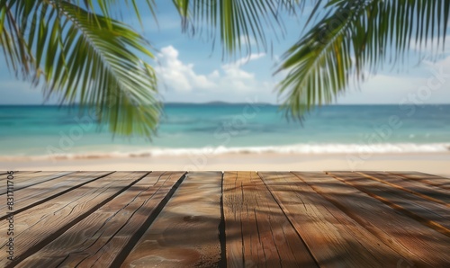 wooden table in the lower foreground with a blurred tropical beach scene in the background