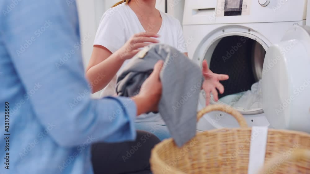 Close up of couple put dirty cloth to washing machine in house together. Close up of couple put dirty cloth to washing machine in house together.