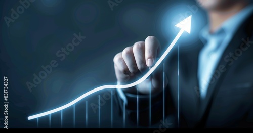 Businessman pointing to rising up line on graph. photo