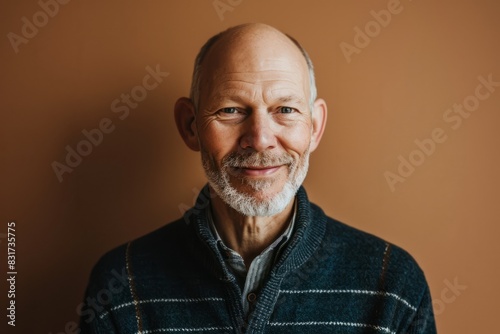 Portrait of a smiling senior man in a blue plaid.