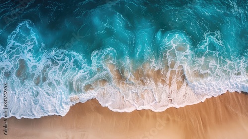 Spectacular top view from drone photo of beautiful beach with relaxing sunlight, sea water waves pounding the sand at the shore. Calmness and refreshing beach scenery