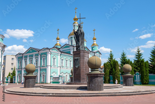 View of the monument to Saint Pitirim Bishop of Tambov and the Transfiguration Cathedral on a sunny June day photo