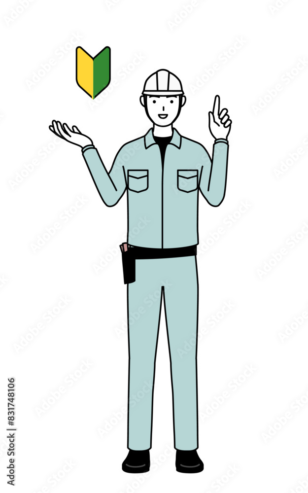 Man in helmet and workwear showing the symbol for young leaves.