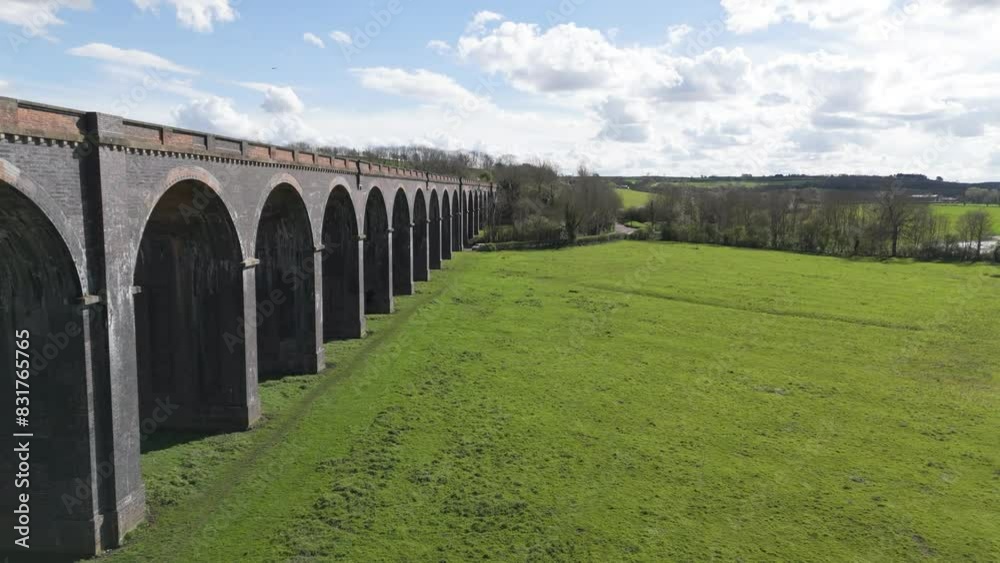 Low drone flight alongside the arches of Welland Viaduct Northamptonshire, also known as the Harringworth and Seaton Viaduct on sunny day Low drone flight alongside the arches of Welland Viaduct Northamptonshire, also known as the Harringworth and Seaton Viaduct on sunny day