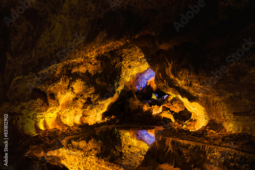 Obraz na płótnie Discover the underground marvel of Cueva de los Verdes in Lanzarote, a stunning reflection in the volcanic tunnel waters, perfect for captivating imagery. w salonie
