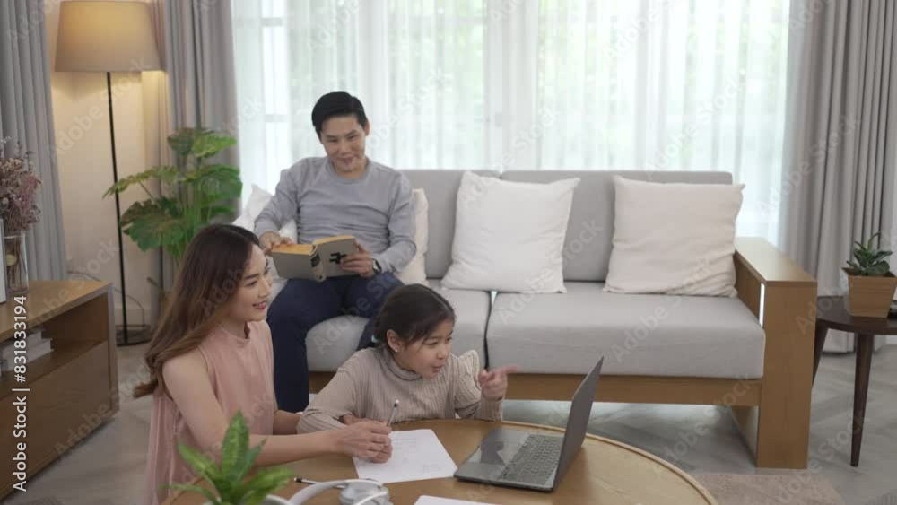 Parents and daughter studying via internet at home. Parents and daughter studying via internet at home.