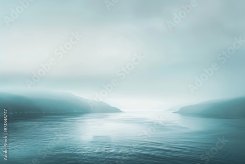 Serene seascape with misty mountains in the distance, creating a peaceful and tranquil atmosphere, perfect for relaxation and meditation. © Panuma