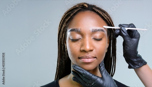 Young woman face during professional eyebrow mapping procedure before permanent makeup and lamination  photo